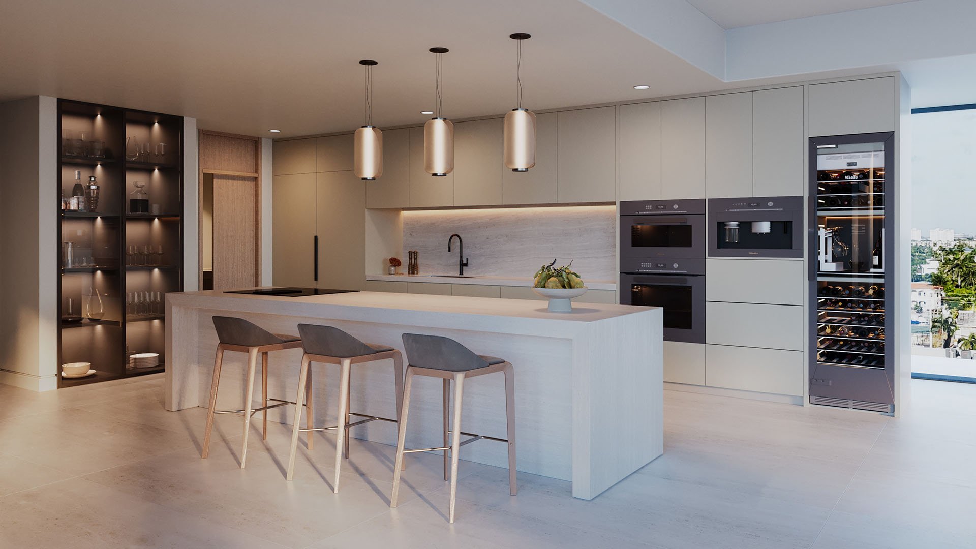Mila Bay Harbor Islands preconstruction luxury and ultra luxury condos in Bay Harbor Islands with a chef kitchen featuring a waterfall island, built-in wine fridge, wall ovens, display shelving, and pendant lights.