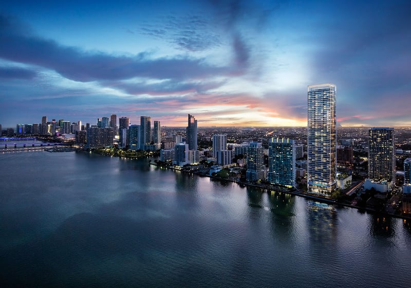 Missoni Baia Edgewater Miami aerial twilight over Biscayne Bay and Downtown Miami skyline, showcasing luxury and ultra luxury preconstruction condos waterfront tower.