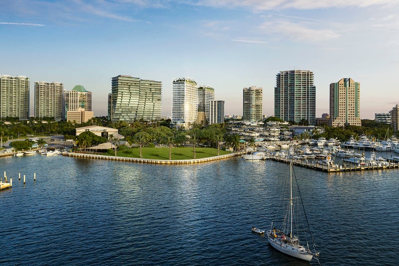 Aerial marina and park view with skyline towers and waterfront boats near Mr C Residences Bayshore Tower in Coconut Grove, presenting luxury, ultra luxury condos in a lush bayside neighborhood.
