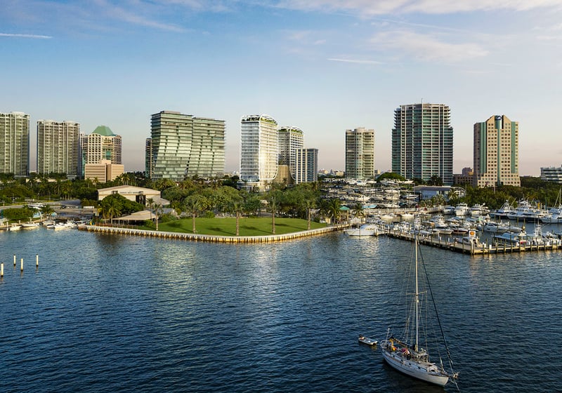 Aerial marina and park view with skyline towers and waterfront boats near Mr C Residences Bayshore Tower in Coconut Grove, presenting luxury, ultra luxury condos in a lush bayside neighborhood.
