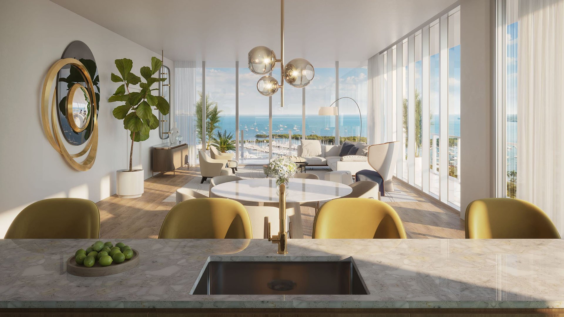 Chef kitchen and dining area framed by a full window wall with bay views at Mr C Residences Bayshore Tower in Coconut Grove, showcasing luxury, ultra luxury condos with airy waterfront entertaining space.