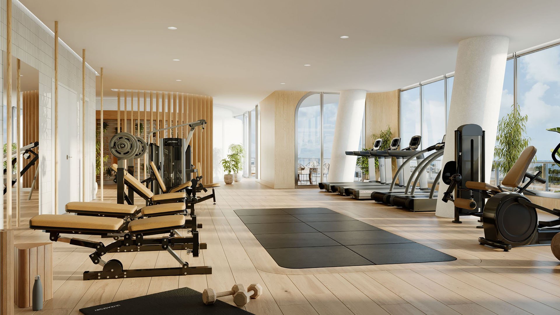 Fitness center with treadmills, strength equipment, mats, and bay views at Mr C Residences Bayshore Tower in Coconut Grove, presenting luxury, ultra luxury condos with a bright waterfront training space.