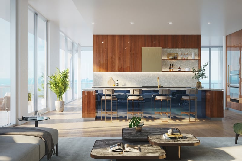 Grand living room and chef kitchen with a long island, marble finishes, and window walls at Mr C Residences Bayshore Tower in Coconut Grove, highlighting luxury, ultra luxury condos with expansive open plan living.