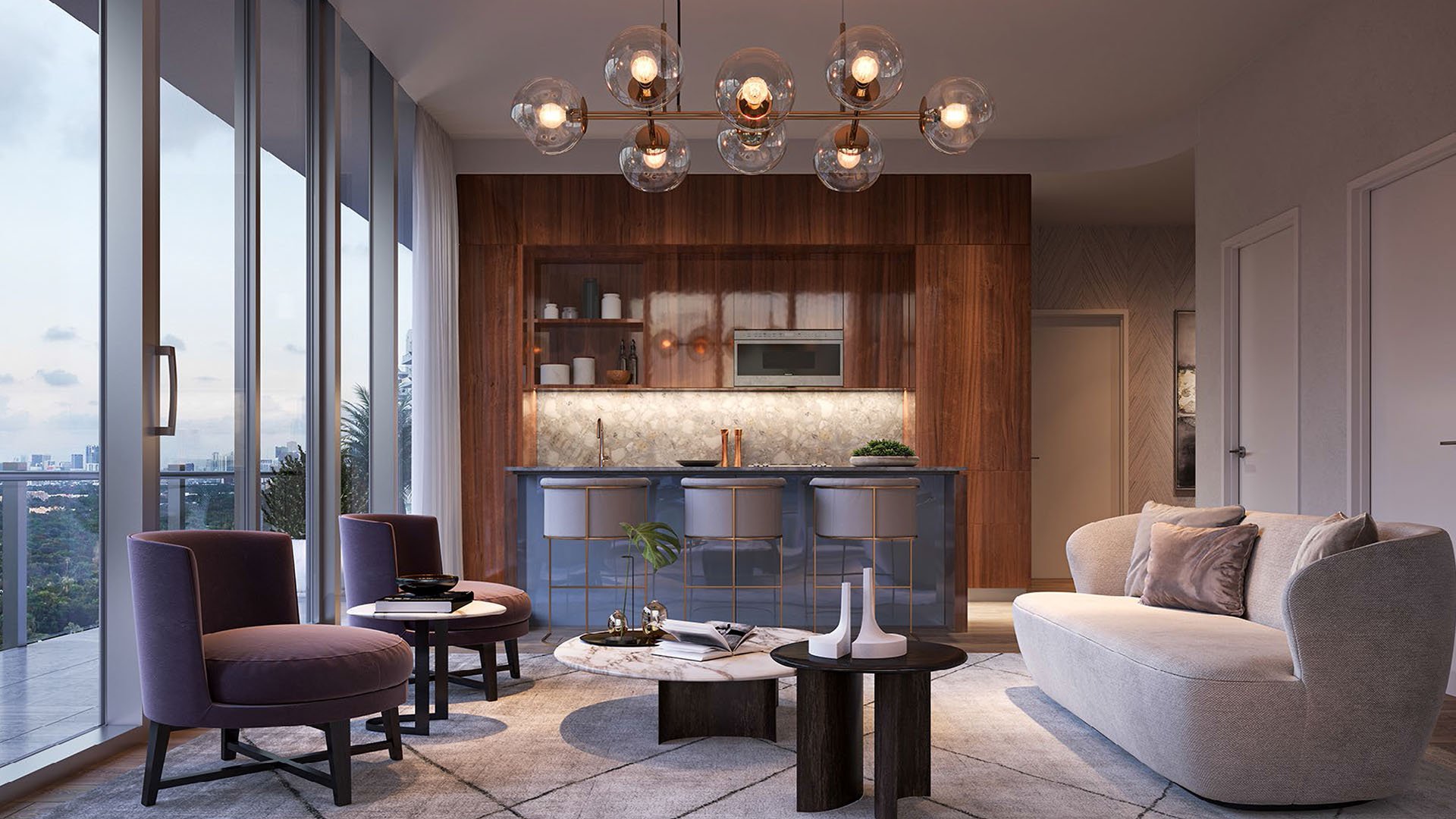 Sunset living room and open kitchen with full height glass and soft curved seating at Mr C Residences Bayshore Tower in Coconut Grove, presenting luxury, ultra luxury condos with elevated evening skyline views.