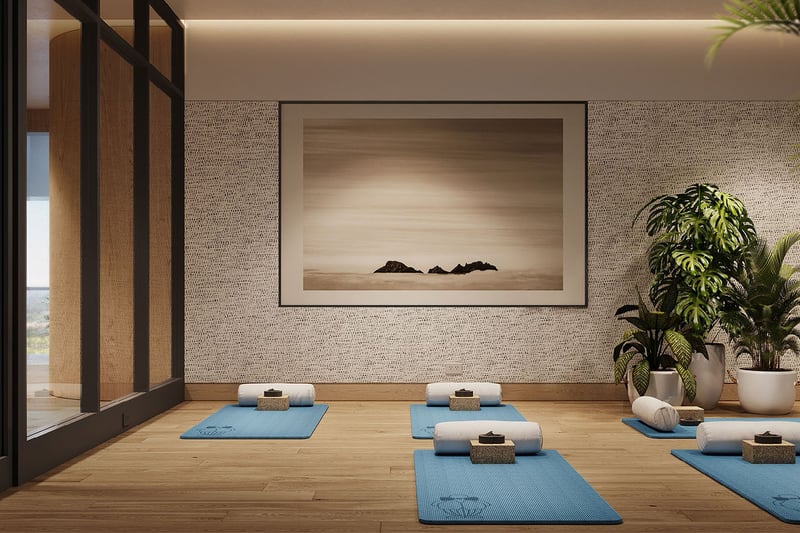 Wellness studio with yoga mats, soft lighting, and serene wall art at Mr C Residences Bayshore Tower in Coconut Grove, featuring luxury, ultra luxury condos with dedicated mindful movement space.