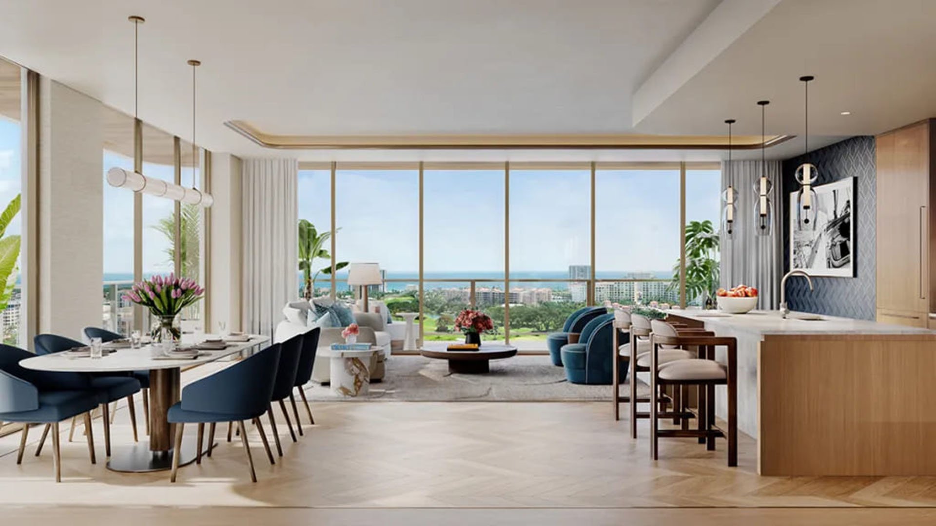 Open-concept chef kitchen, dining, and living room at Mr. C Residences in Boca Raton with floor-to-ceiling glass and ocean views, representing preconstruction luxury and ultra luxury condos.