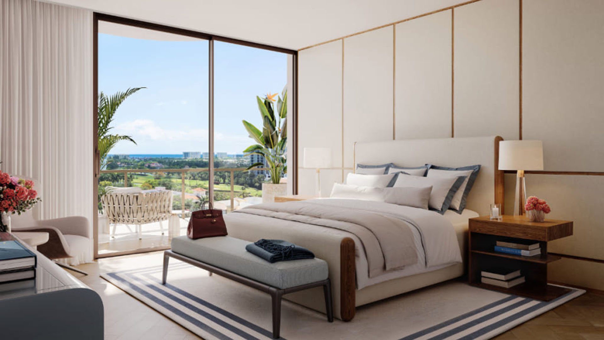 Primary bedroom suite at Mr. C Residences in Boca Raton with a private terrace, floor-to-ceiling glass, and distant ocean views, illustrating preconstruction luxury and ultra luxury condos.