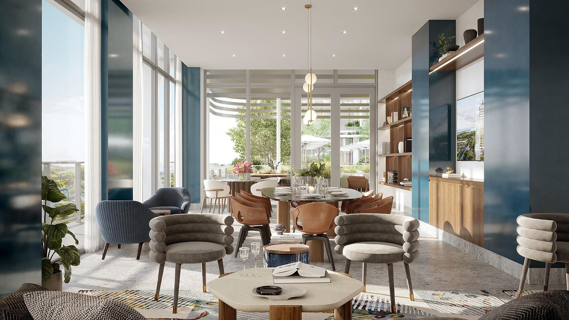 Casual lounge with private dining seating, tall windows and garden views at Mr. C Residences Tigertail Tower, Coconut Grove, serving luxury and ultra luxury condos.