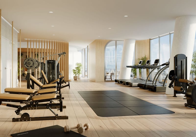 Fitness center with treadmills, strength machines and full-height windows at Mr. C Residences Tigertail Tower, Coconut Grove, an amenity for luxury and ultra luxury condos.