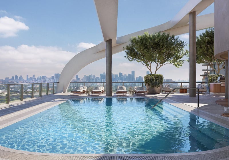 Rooftop pool terrace with curved architecture and skyline views at Mr. C Residences Tigertail Tower, Coconut Grove, defining luxury and ultra luxury condos.