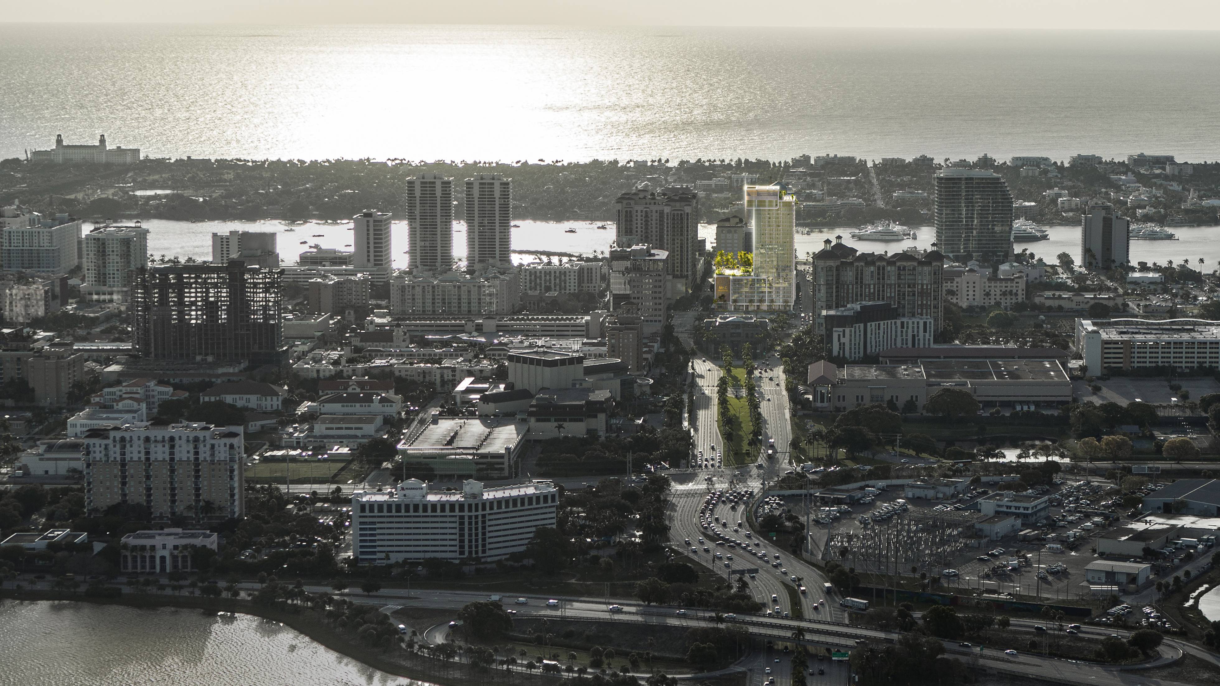 Mr. C Residences West Palm Beach sunset over the water and skyline, showcasing luxury and ultra luxury preconstruction condos. Featuring cityscape.