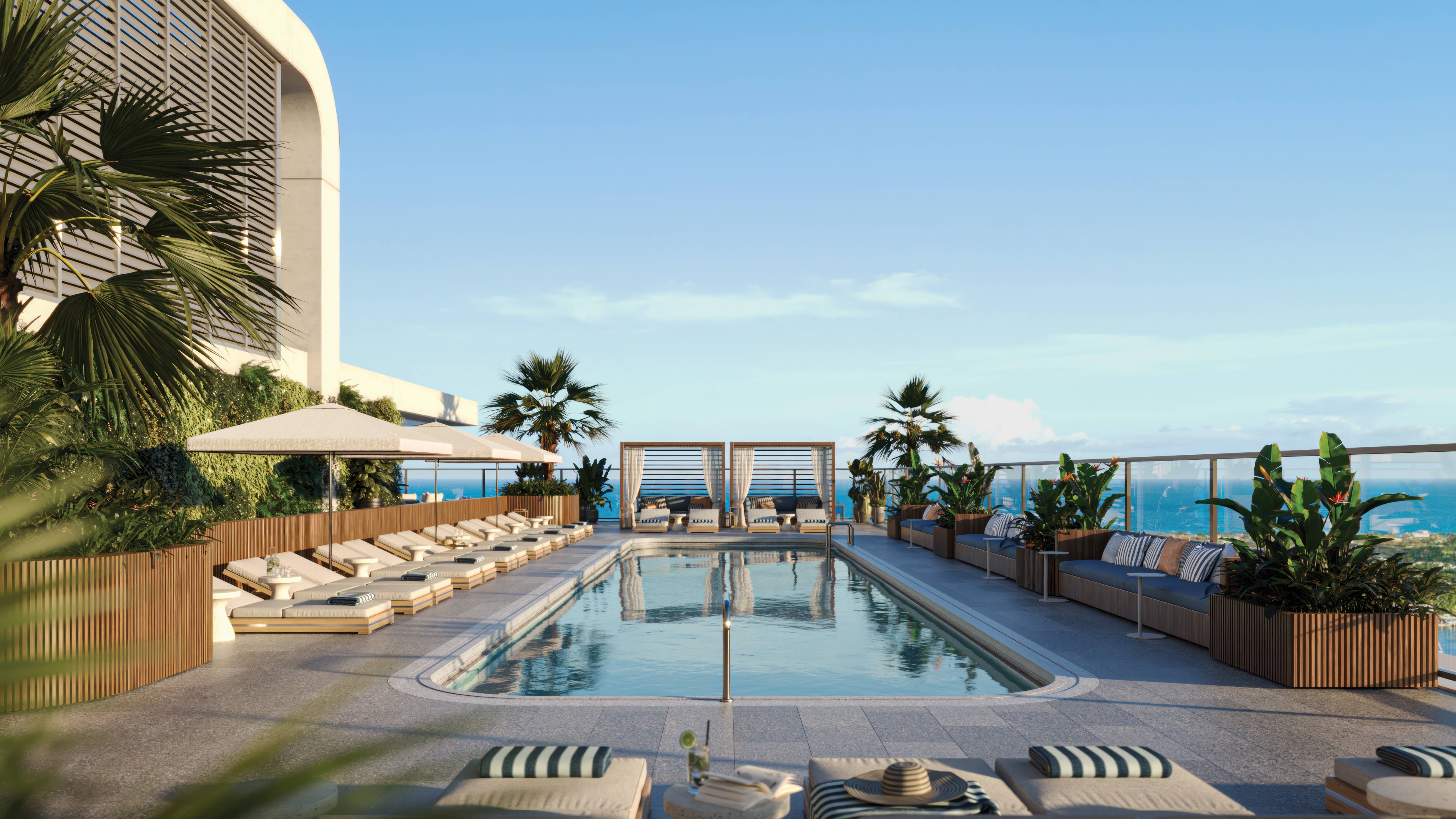 Mr. C Residences West Palm Beach rooftop pool loungers with ocean view, luxury and ultra luxury preconstruction condos lifestyle.