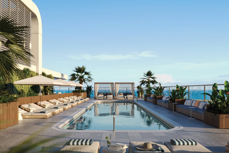 Mr. C Residences West Palm Beach rooftop pool loungers with ocean view, luxury and ultra luxury preconstruction condos lifestyle.