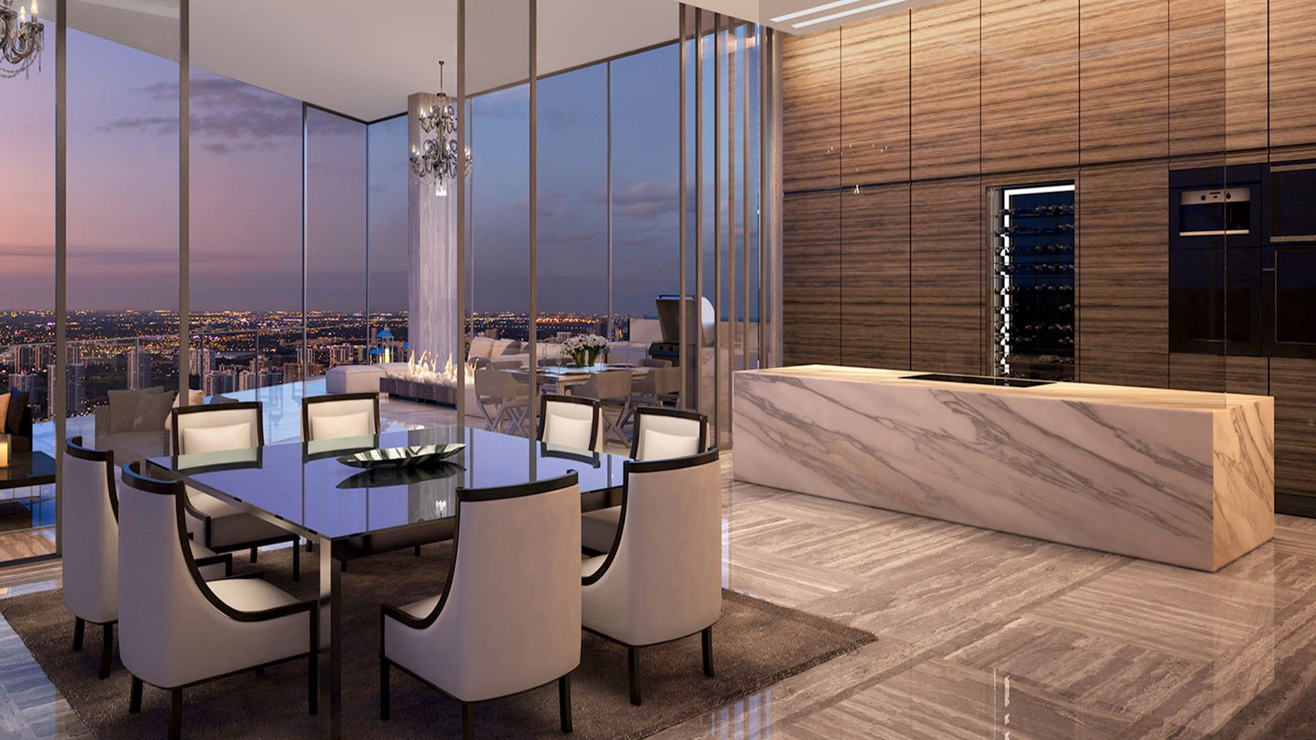 Corner dining room with a marble island, floor-to-ceiling glass, and a fireplace terrace at Muse Residences in Sunny Isles Beach, reflecting luxury and ultra luxury condos.
