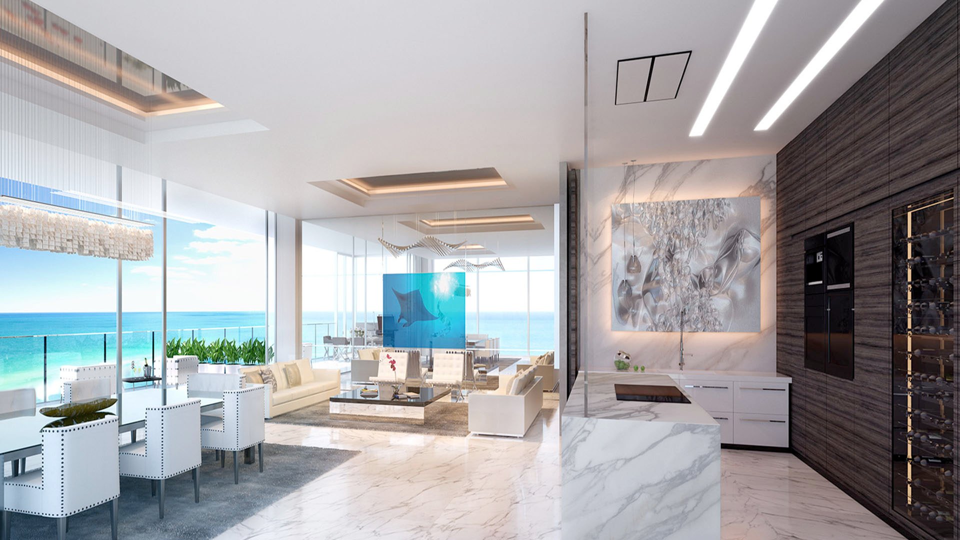 Open oceanview great room with dining, marble finishes, and a blue art divider at Muse Residences in Sunny Isles Beach, styled for luxury and ultra luxury condos.