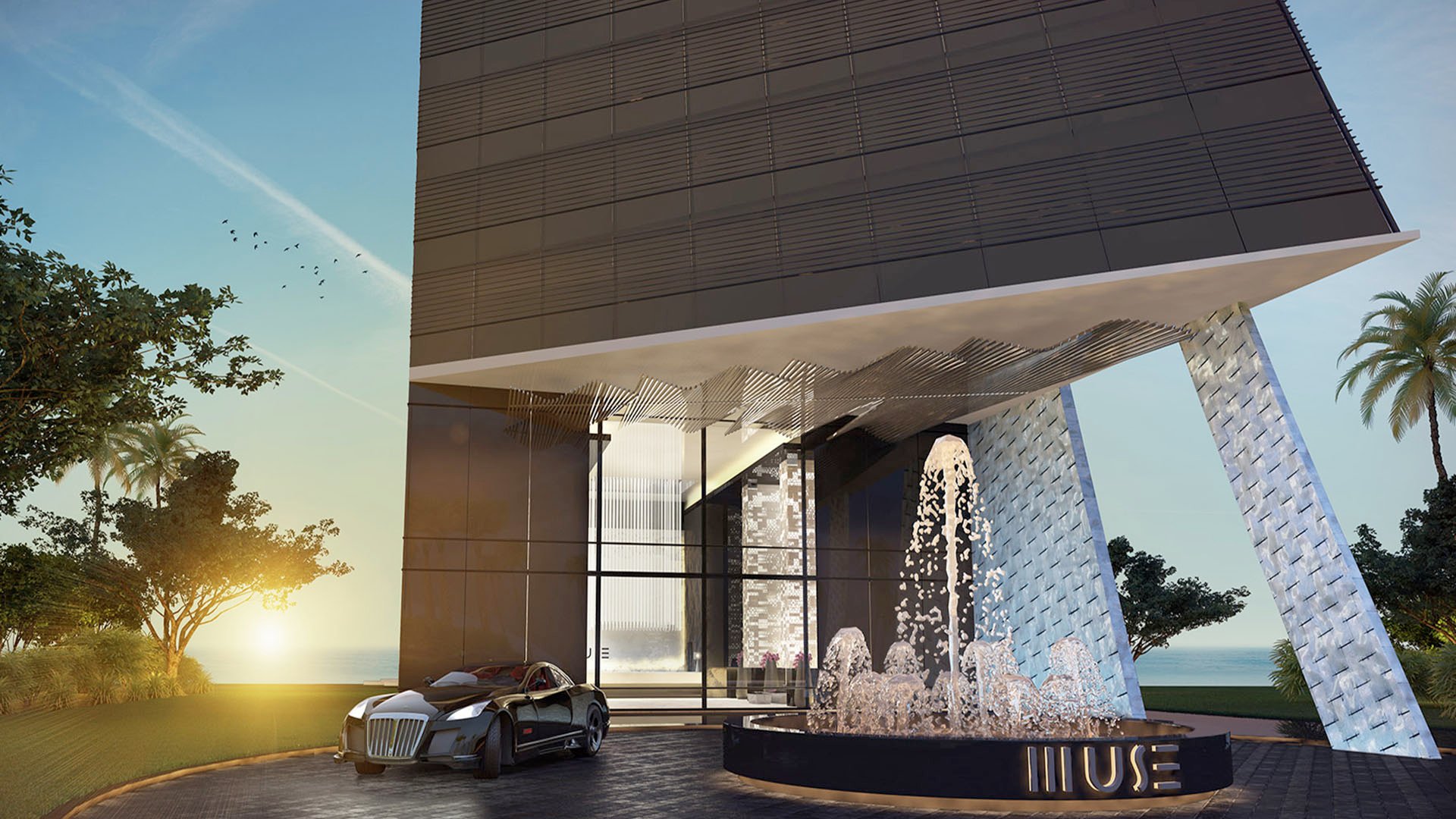Porte cochere entry with a fountain, sculptural canopy, and dramatic drop-off at Muse Residences in Sunny Isles Beach, introducing luxury and ultra luxury condos.
