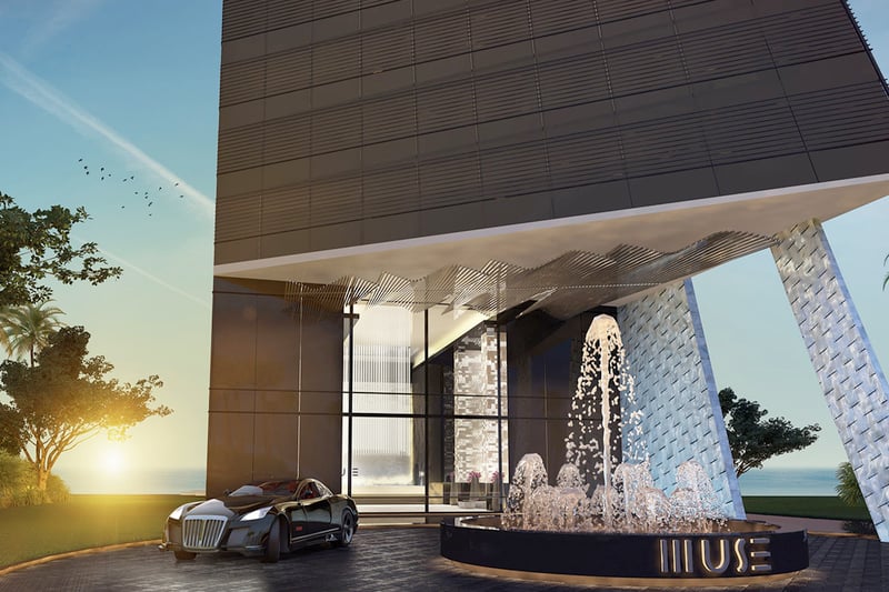 Porte cochere entry with a fountain, sculptural canopy, and dramatic drop-off at Muse Residences in Sunny Isles Beach, introducing luxury and ultra luxury condos.
