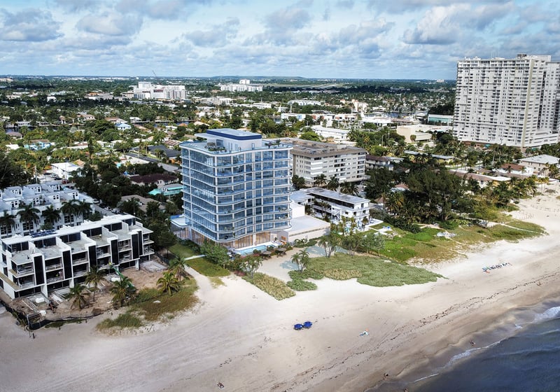 Aerial view of Ocean 580 in Pompano Beach, preconstruction luxury and ultra luxury condos showing the oceanfront tower, broad beach, surrounding neighborhood and nearby waterfront high-rises.