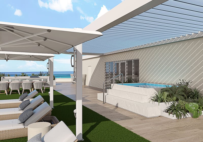 Rooftop pergola lounge at Ocean 580 in Pompano Beach, preconstruction luxury and ultra luxury condos with shaded sun loungers, outdoor dining, a raised spa and open ocean views.
