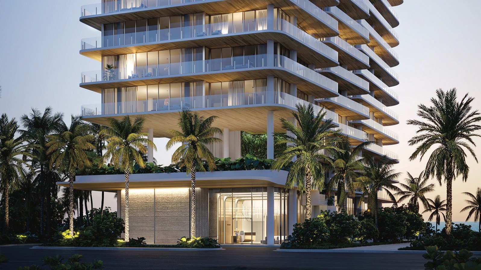 Ocean House, Miami Beach night view of modern beachfront condo. South of Fifth; illuminated façade for luxury and ultra luxury condos; resale.