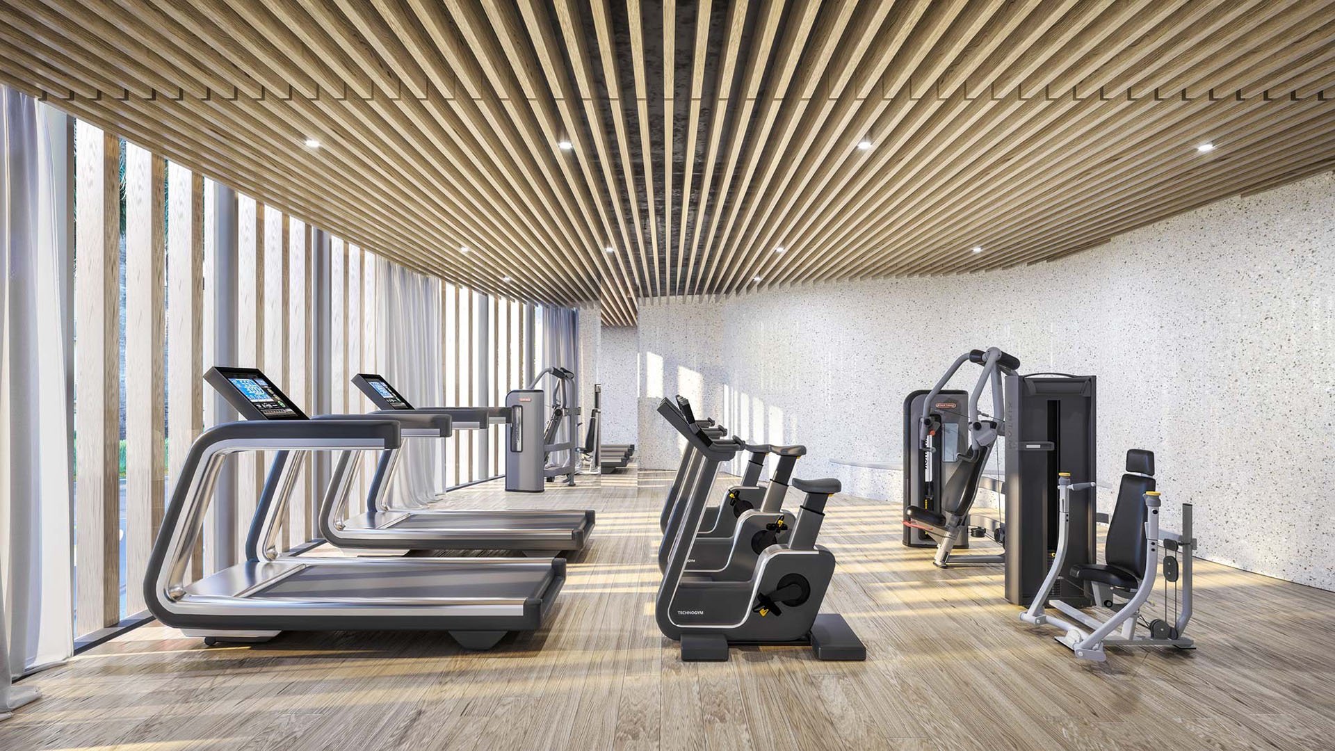 Onda Bay Harbor gym in Bay Harbor Islands, Miami, Florida featuring treadmills, recumbent bikes and strength machines under a wood-slat ceiling-luxury and ultra luxury preconstruction condos wellness amenity.