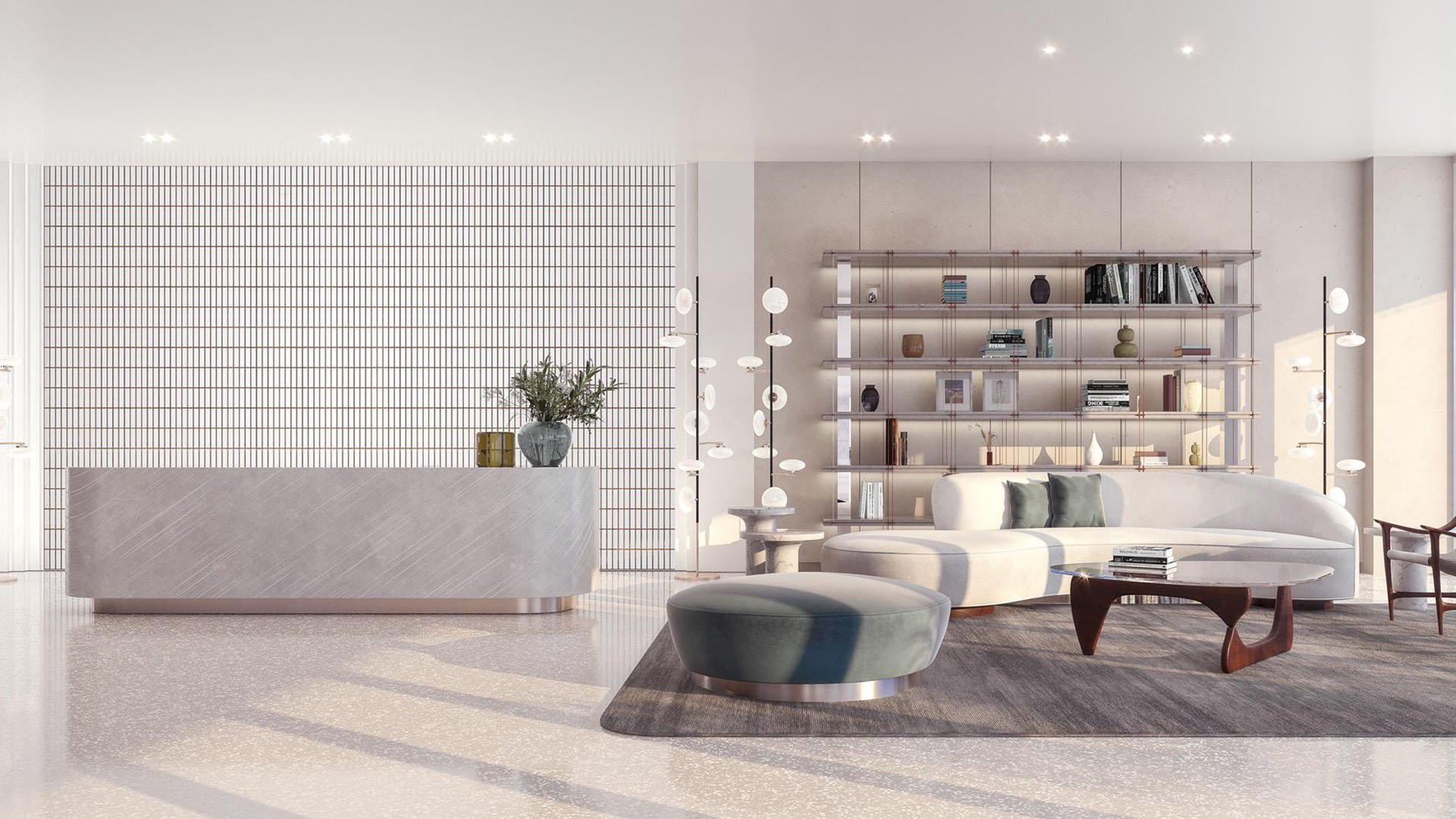 Onda Bay Harbor condominium lobby in Bay Harbor Islands, Miami, Florida with reception desk, curved sofa seating and designer bookshelf-luxury and ultra luxury preconstruction condos arrival experience.