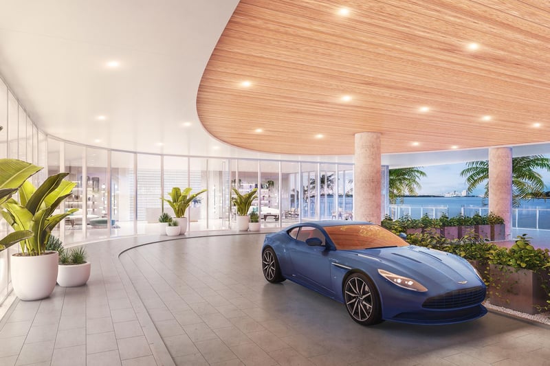 Onda Bay Harbor porte cochere arrival in Bay Harbor Islands, Miami, Florida with curved canopy, glass lobby and luxury car drop-off overlooking the bay-ultra luxury preconstruction condos entrance.