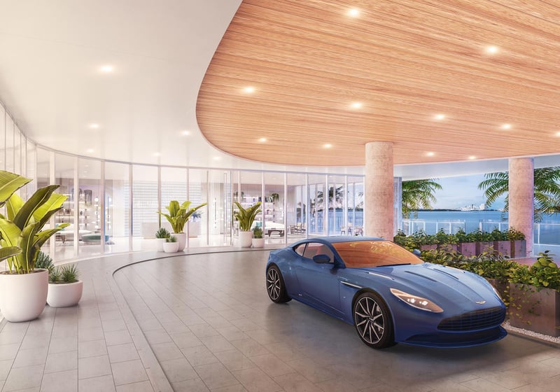 Onda Bay Harbor porte cochere arrival in Bay Harbor Islands, Miami, Florida with curved canopy, glass lobby and luxury car drop-off overlooking the bay-ultra luxury preconstruction condos entrance.