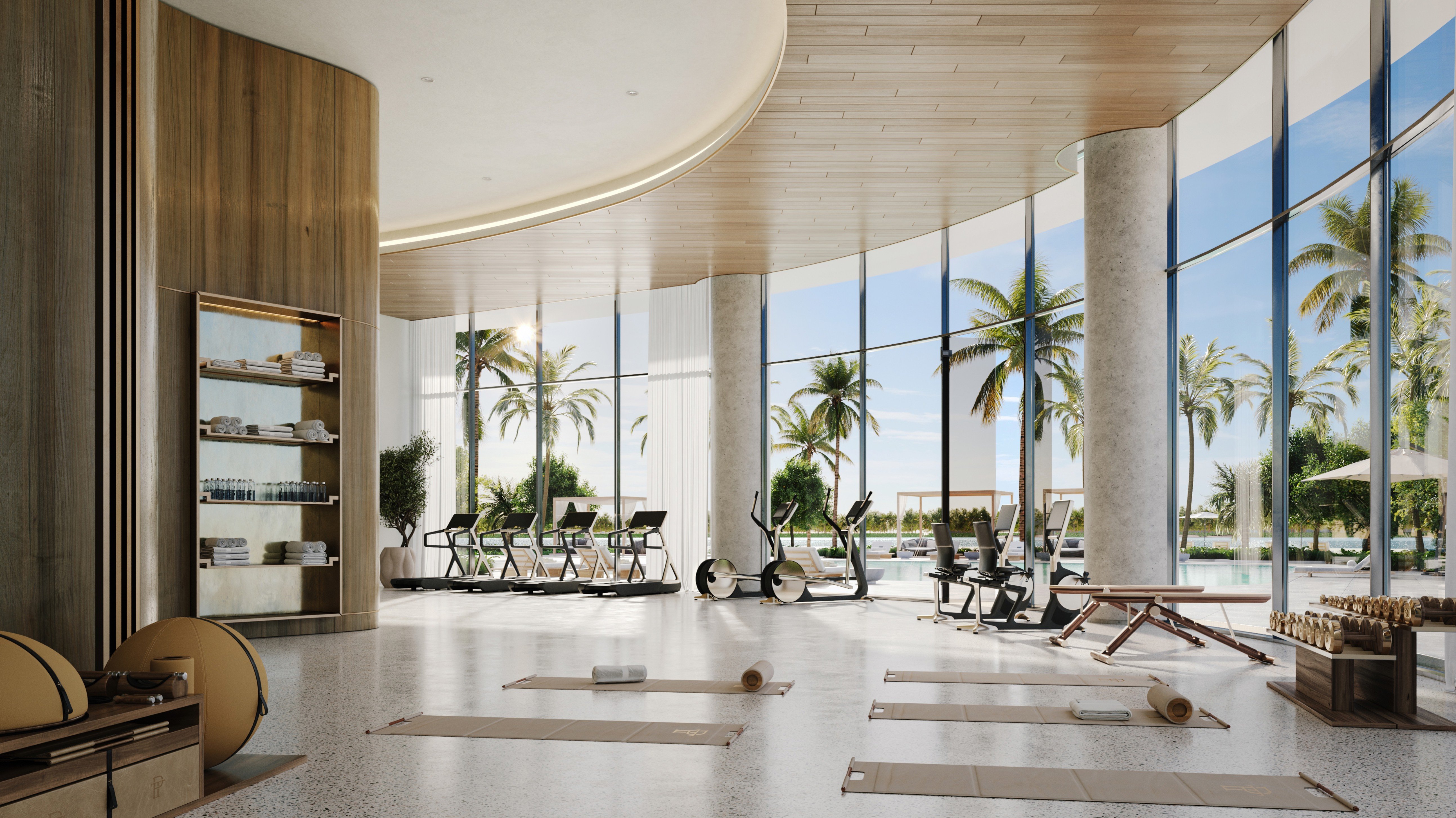 One Park Tower by Turnberry gym with tropical views in North Miami; luxury fitness amenity for ultra luxury preconstruction condos. Featuring interior and view.