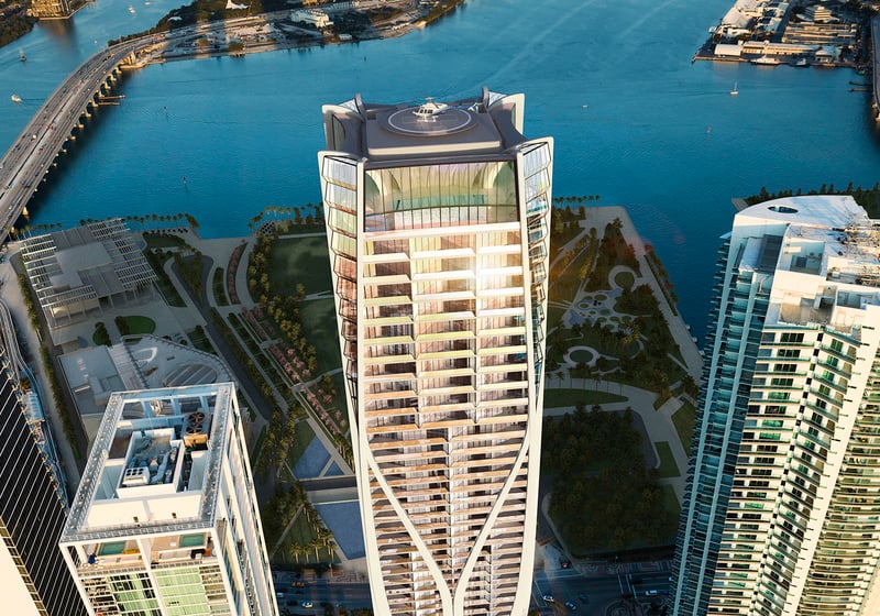 Top-down aerial of One Thousand Museum in Downtown Miami with the rooftop helipad, surrounding towers, and waterfront below, highlighting luxury and ultra luxury condos.
