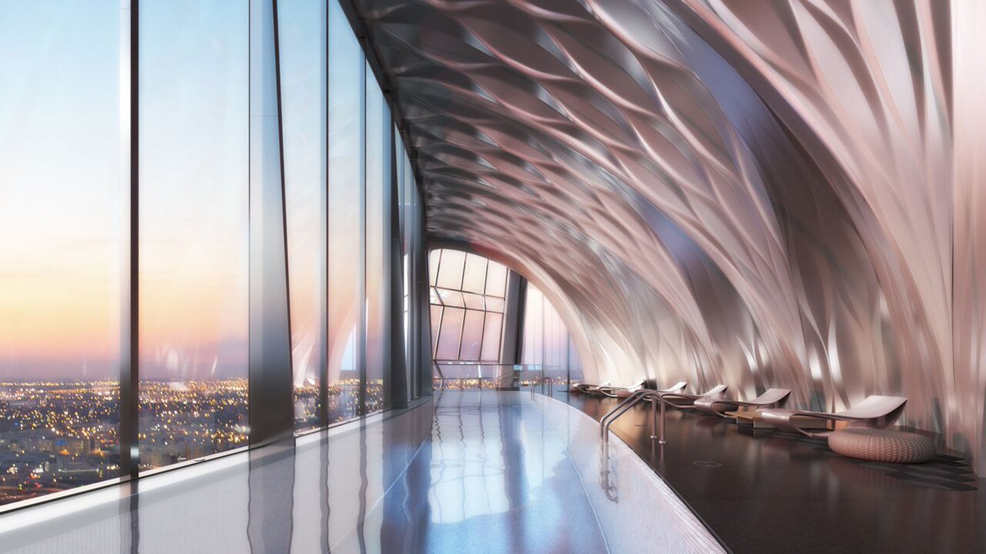 Aquatic sky lounge at One Thousand Museum in Downtown Miami with a long lap pool, sculptural ceiling, daybeds, and sunset skyline views for luxury and ultra luxury condos.