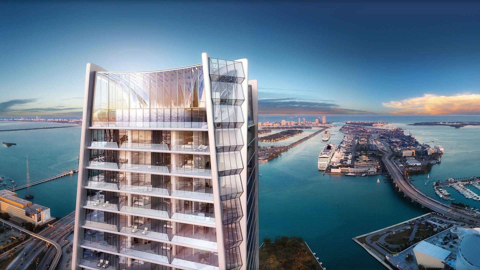 Upper crown residences at One Thousand Museum in Downtown Miami above the waterfront, showcasing the glassy top floors of luxury and ultra luxury condos.