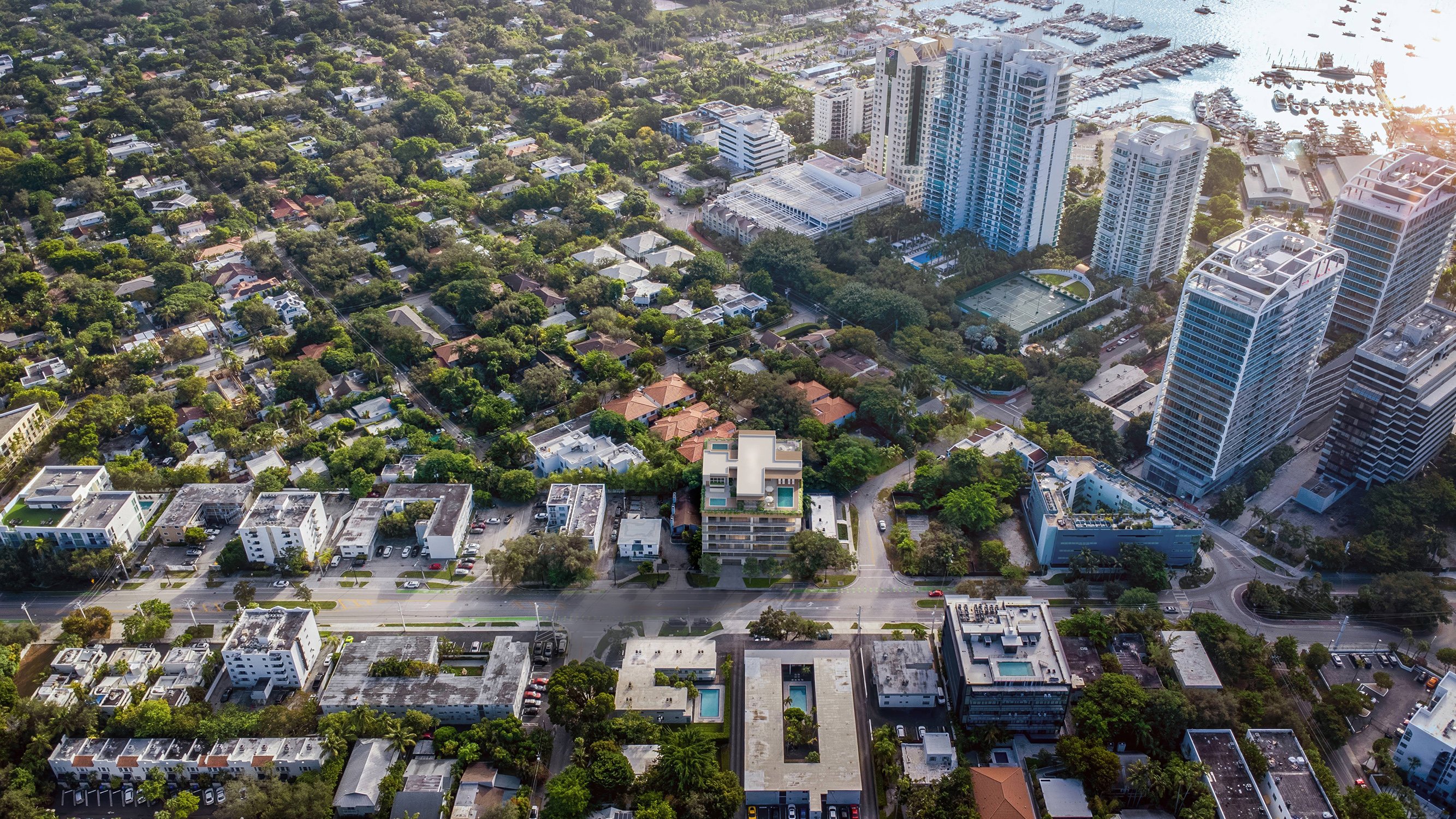 Opus Coconut Grove aerial cityscape view in Coconut Grove, Miami, showcasing luxury and ultra luxury preconstruction condos. Featuring modern and suburban.