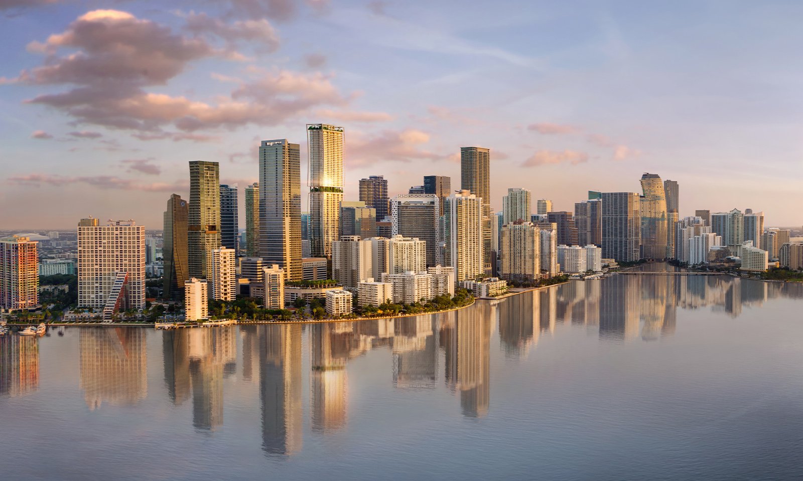ORA by Casa Tua, Brickell Miami sunset skyline reflected on Biscayne Bay—central location for luxury and ultra luxury condos; preconstruction.