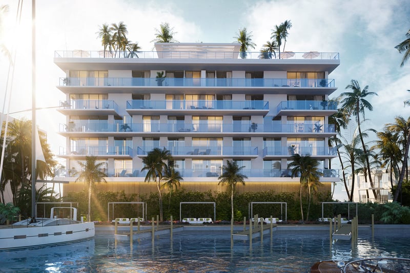 Sunrise marina view of Origin Residences Bay Harbor Islands waterfront building with glass balconies, palm trees and docks, Miami, Florida, featuring luxury and ultra luxury preconstruction condos with boat slips.