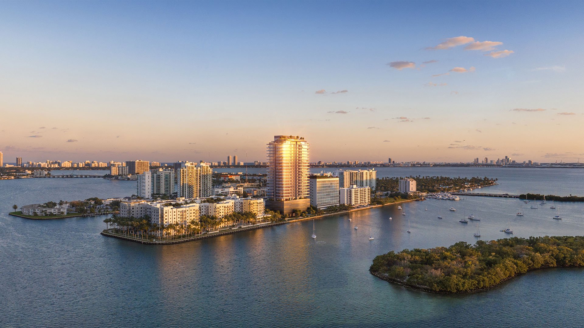 Sunset aerial of Pagani Residences in North Bay Village, Miami, Florida on Biscayne Bay, glowing tower against Miami skyline; luxury and ultra luxury preconstruction condos with waterfront views.