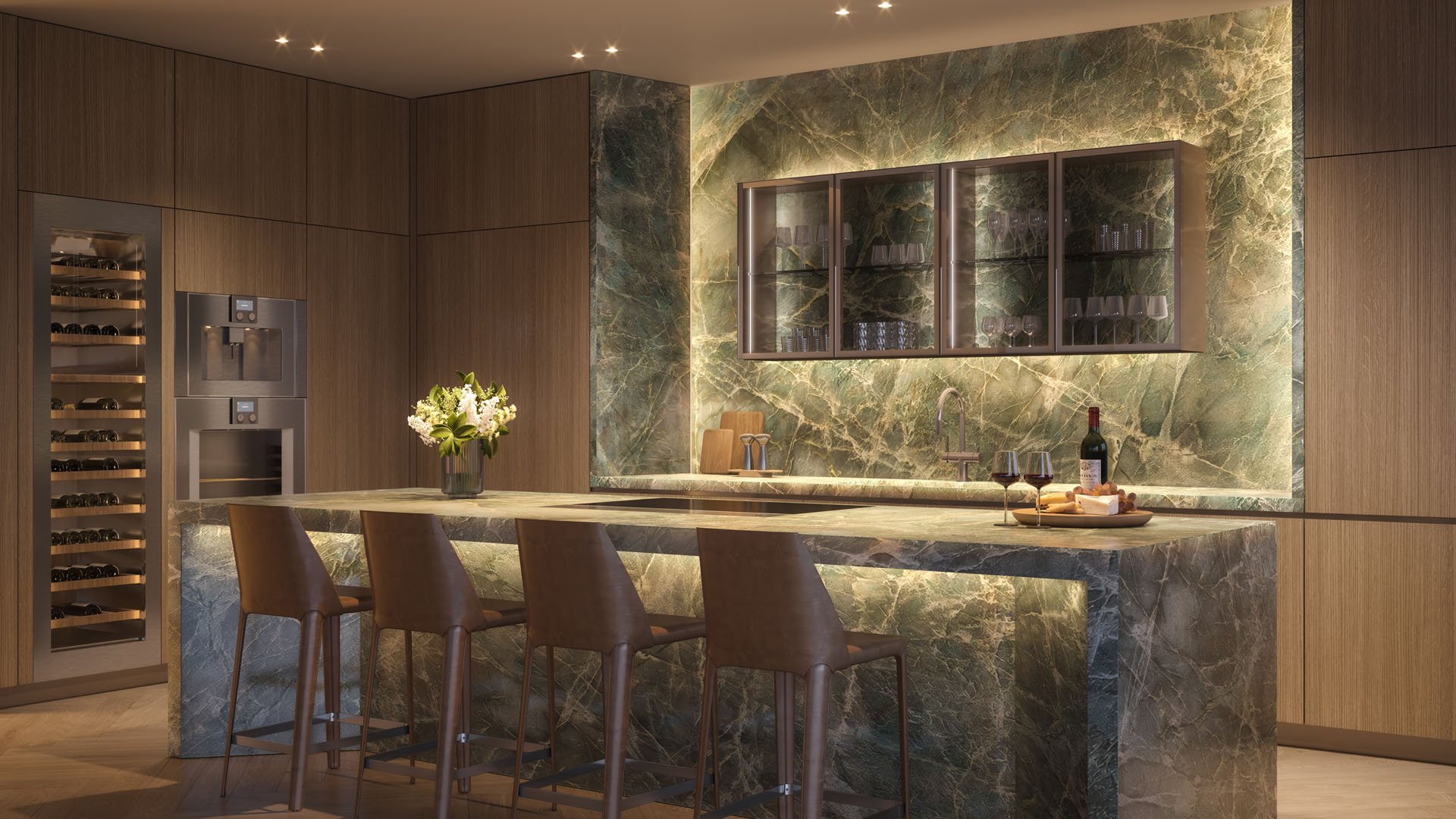 Pagani Residences evening bar kitchen in North Bay Village, Miami, Florida with Jadore green marble waterfall island, ambient lighting and wine-and-cheese display; luxury and ultra luxury preconstruction condos.