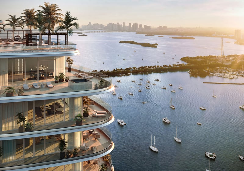 Sunrise view from Pagani Residences penthouse terrace, North Bay Village, Miami, Florida, curved glass balcony overlooking Biscayne Bay yachts and Miami skyline; luxury and ultra luxury preconstruction condos.