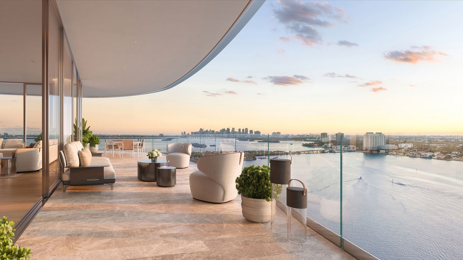 Pagani Residences North Bay Village Miami waterfront terrace balcony at sunset with Biscayne Bay and Downtown Miami skyline views, showcasing luxury and ultra luxury preconstruction condos outdoor living.