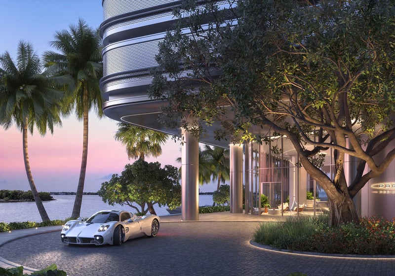 Pagani Residences North Bay Village Miami porte cochere arrival driveway at sunset with palm trees and waterfront setting, introducing luxury and ultra luxury preconstruction condos in Miami, Florida.