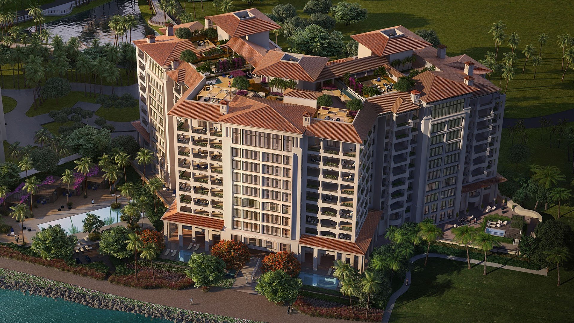 Aerial exterior view of Palazzo del Sol, Fisher Island, showing luxury and ultra luxury condos with terraced rooftops, lush courtyards, and the building massing from above.