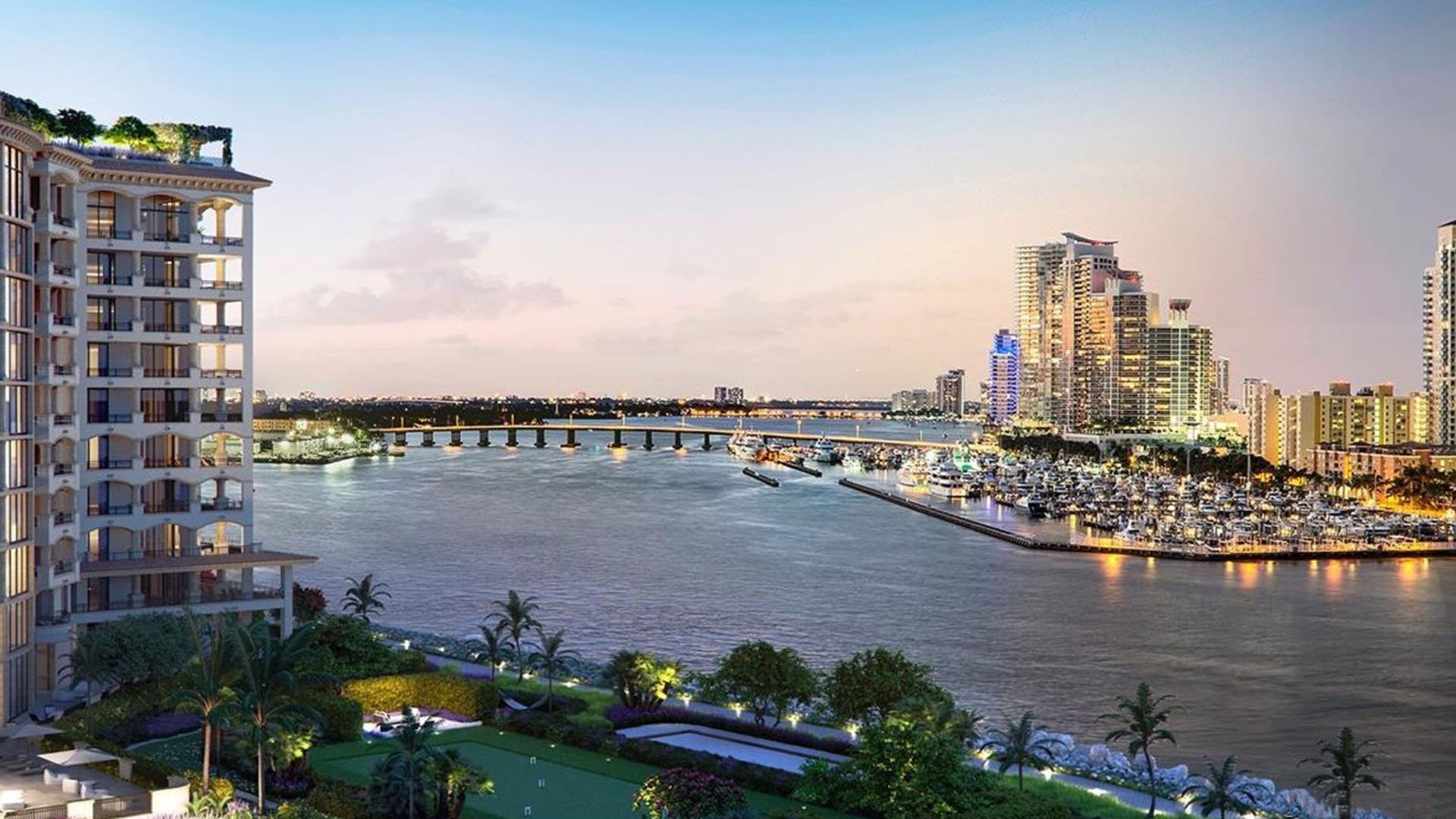 Palazzo della Luna in Fisher Island luxury and ultra luxury condos with a close waterfront exterior view toward the bridge, marina, bay, and city lights.