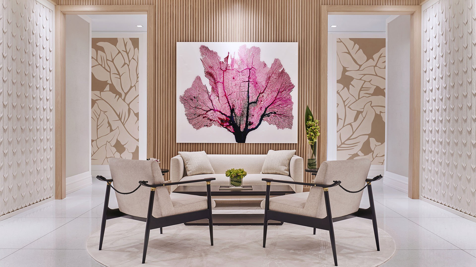 Palazzo della Luna in Fisher Island luxury and ultra luxury condos with a grand lobby, sculptural seating, pale stone finishes, and large floral artwork.