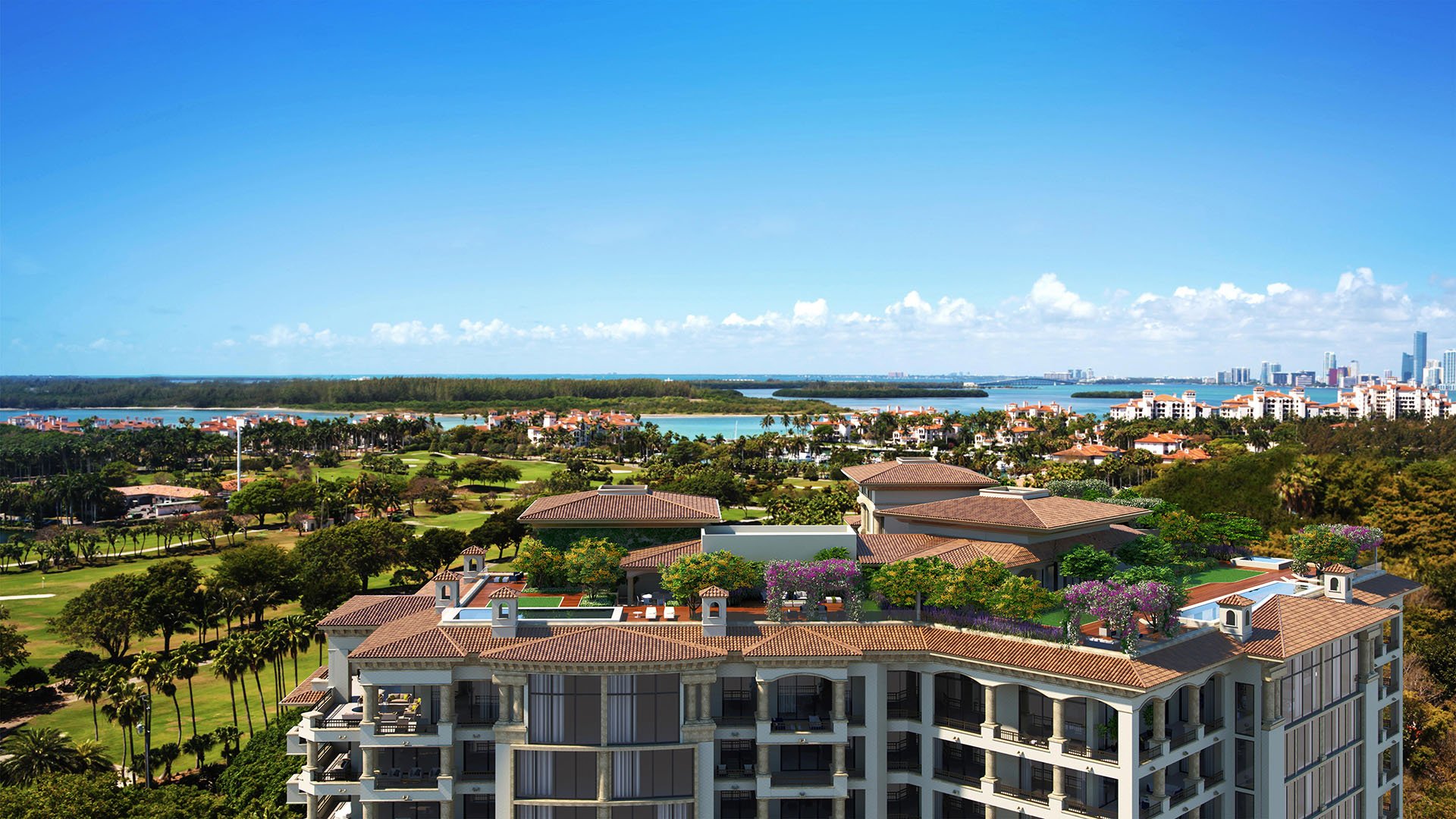 Palazzo della Luna in Fisher Island luxury and ultra luxury condos with penthouse rooftop terraces overlooking the bay, gardens, and a distant skyline.