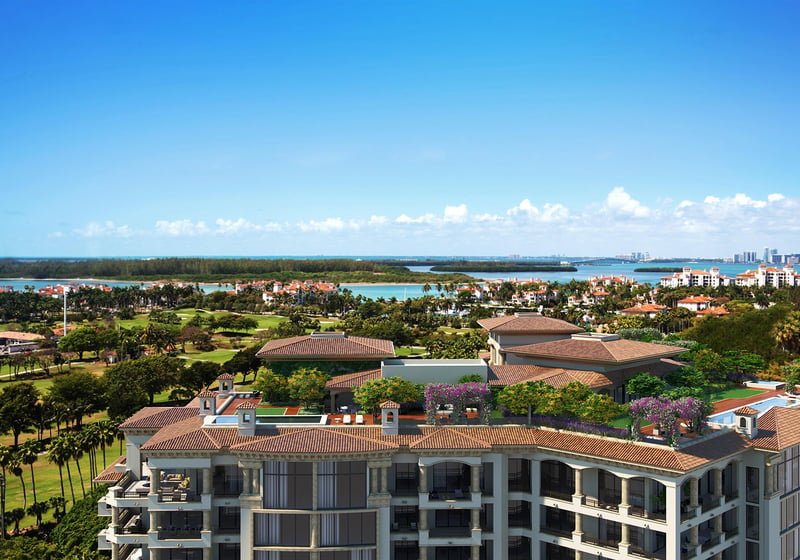 Palazzo della Luna in Fisher Island luxury and ultra luxury condos with penthouse rooftop terraces overlooking the bay, gardens, and a distant skyline.