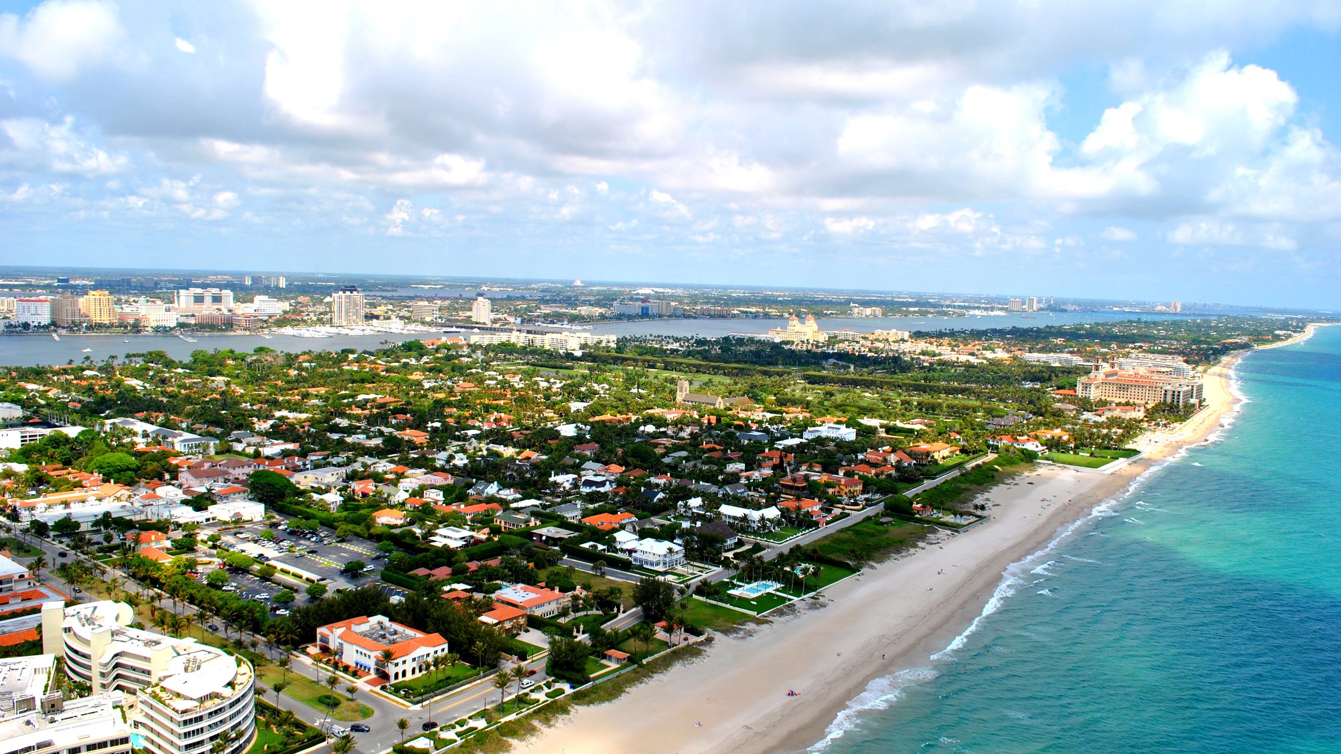 Palm Beach, Florida coastal aerial over Atlantic shoreline and Intracoastal, exclusive enclave of luxury and ultra luxury condos; active preconstruction and resale market. Featuring view.