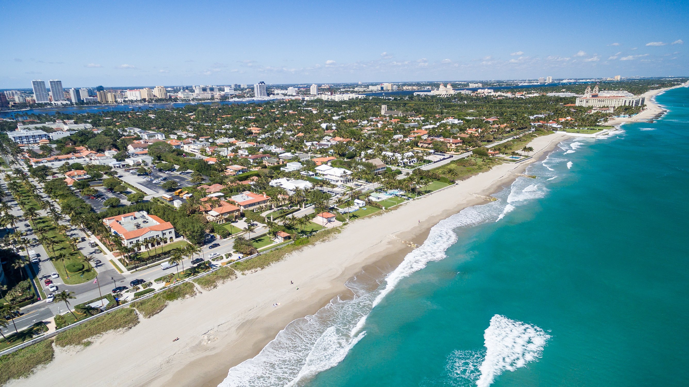 Palm Beach, Florida coastline and island vistas from above, iconic Gold Coast setting for luxury and ultra luxury condos; robust preconstruction and resale inventory. Featuring coastal, aerial, and view.
