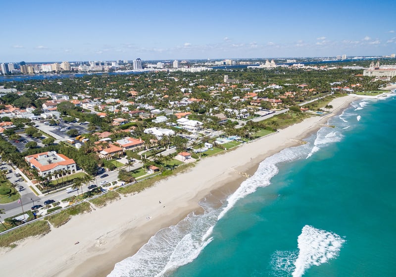 Palm Beach, Florida coastline and island vistas from above, iconic Gold Coast setting for luxury and ultra luxury condos; robust preconstruction and resale inventory. Featuring coastal, aerial, and view.