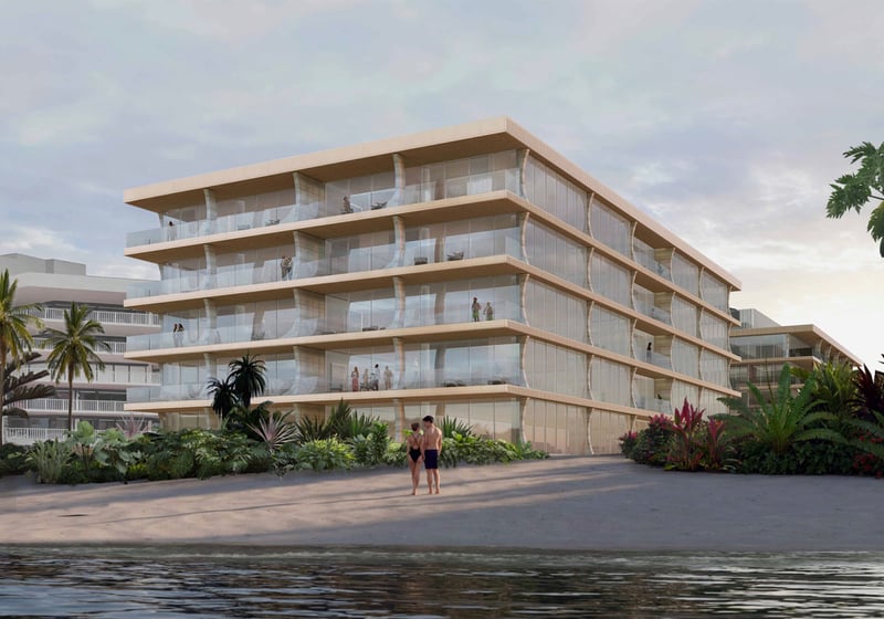 Palm Beach Residences by Aman, Palm Beach, Florida beachfront low-rise with flowing glass balconies and ocean shoreline, showcasing luxury and ultra luxury preconstruction condos with resort-style tropical landscaping.