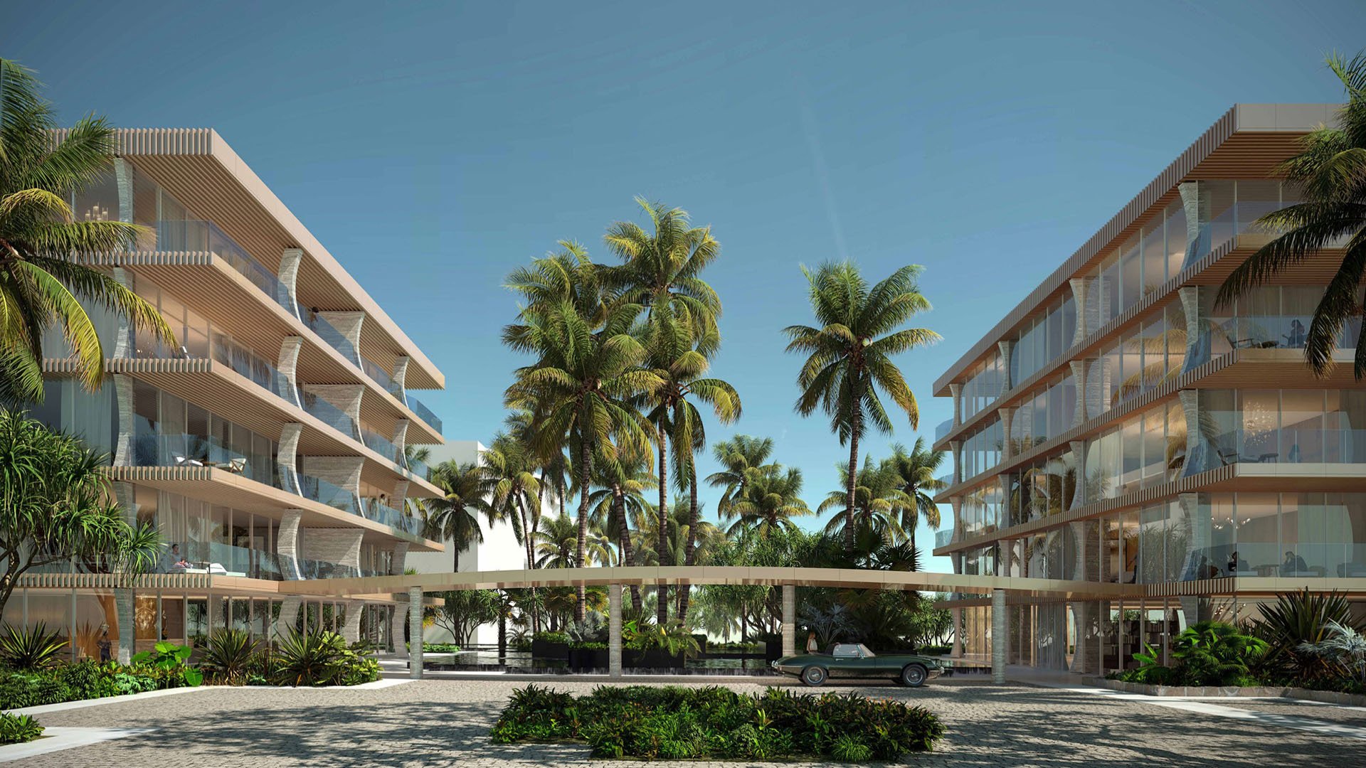 Arrival courtyard at Palm Beach Residences by Aman, Palm Beach, Florida, twin modern condo buildings around a palm-lined porte-cochere and circular drive, featuring luxury and ultra luxury preconstruction condos with hotel-style entry.